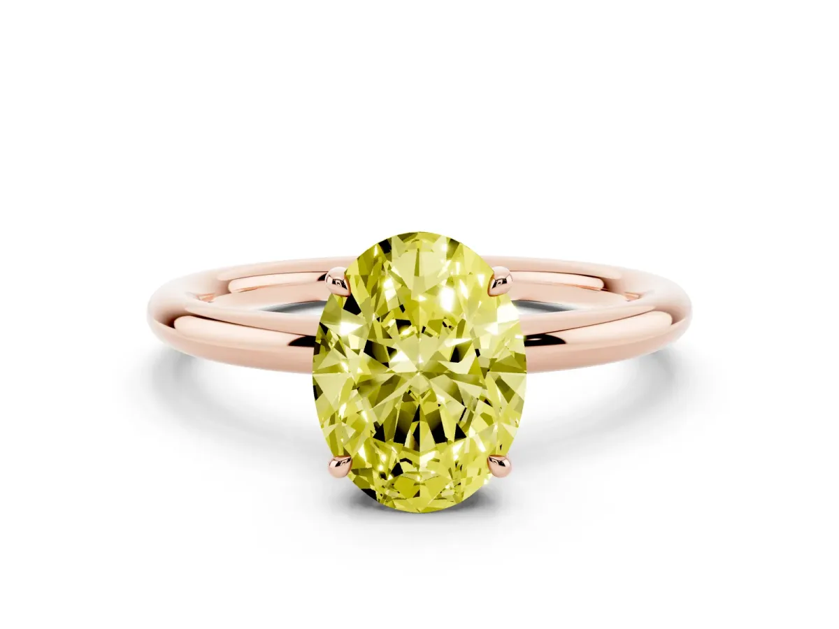 Fancy Yellow Oval Cut Diamond Solitaire Ring with Thin Band and Four-Prong Setting Rose gold