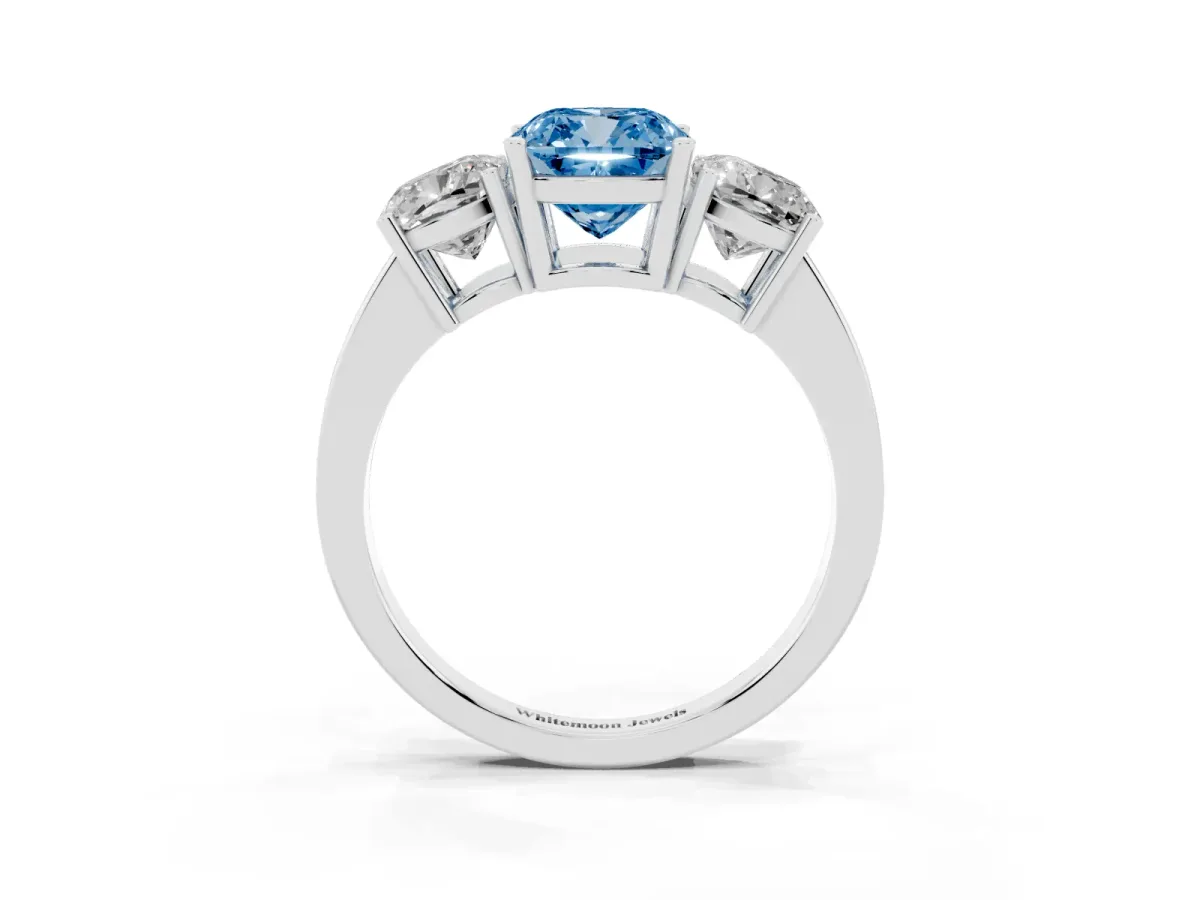 Fancy Blue Three-Stone Cushion Cut Cut Diamond Engagement Ring with Flat Band and Four-Prong Setting Silver