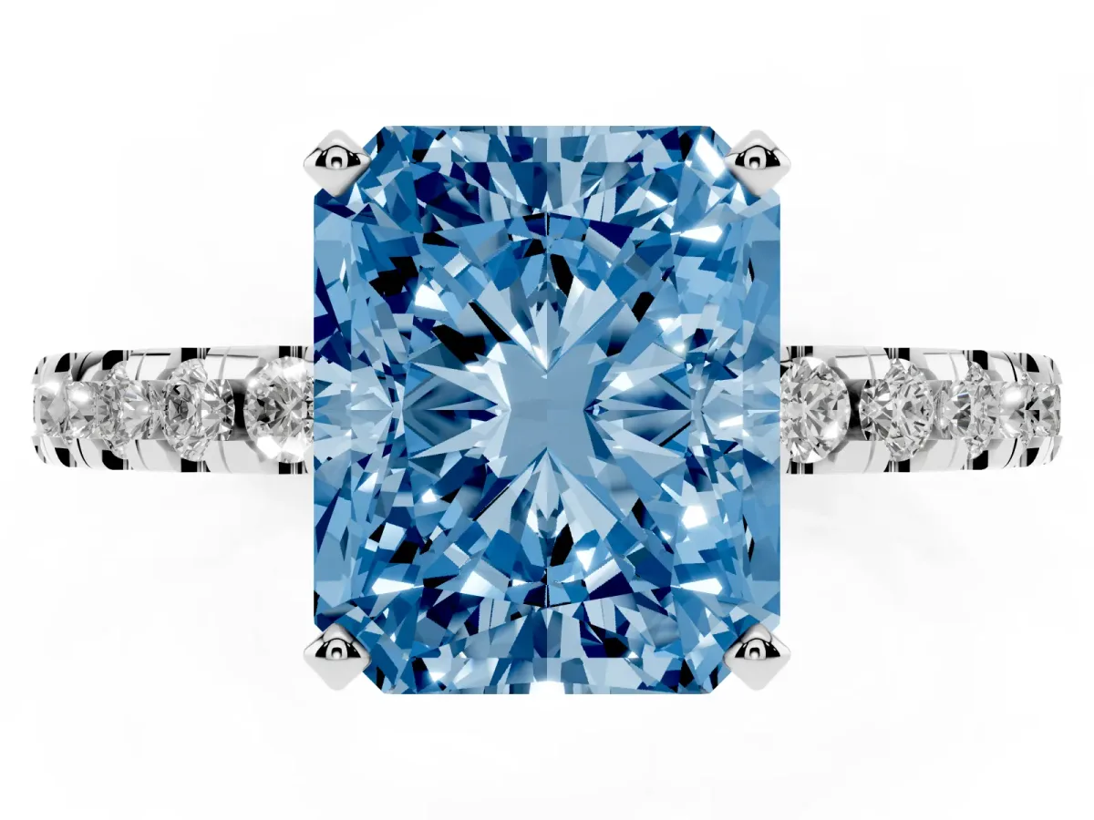 Fancy Blue Radiant Cut Diamond Solitaire Ring with Round Pavé Band and Four-Prong Setting Silver