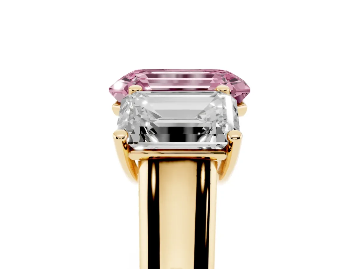 Fancy Pink Emerald Cut Three-Stone Diamond Ring with Prong Setting on a Classic Band Yellow gold