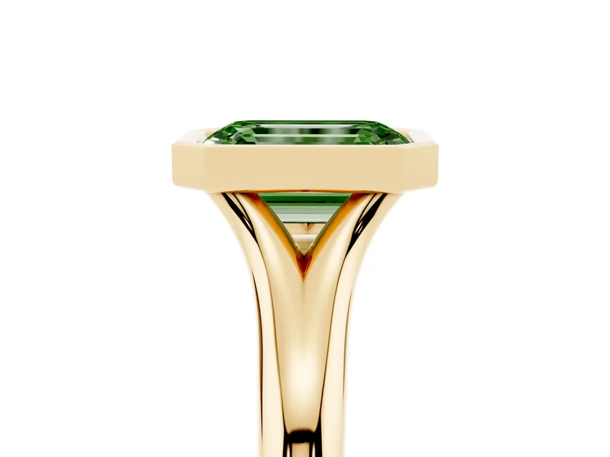 Fancy Green Bezel Set Emerald Cut Solitaire Diamond Ring with Smooth Band Yellow gold