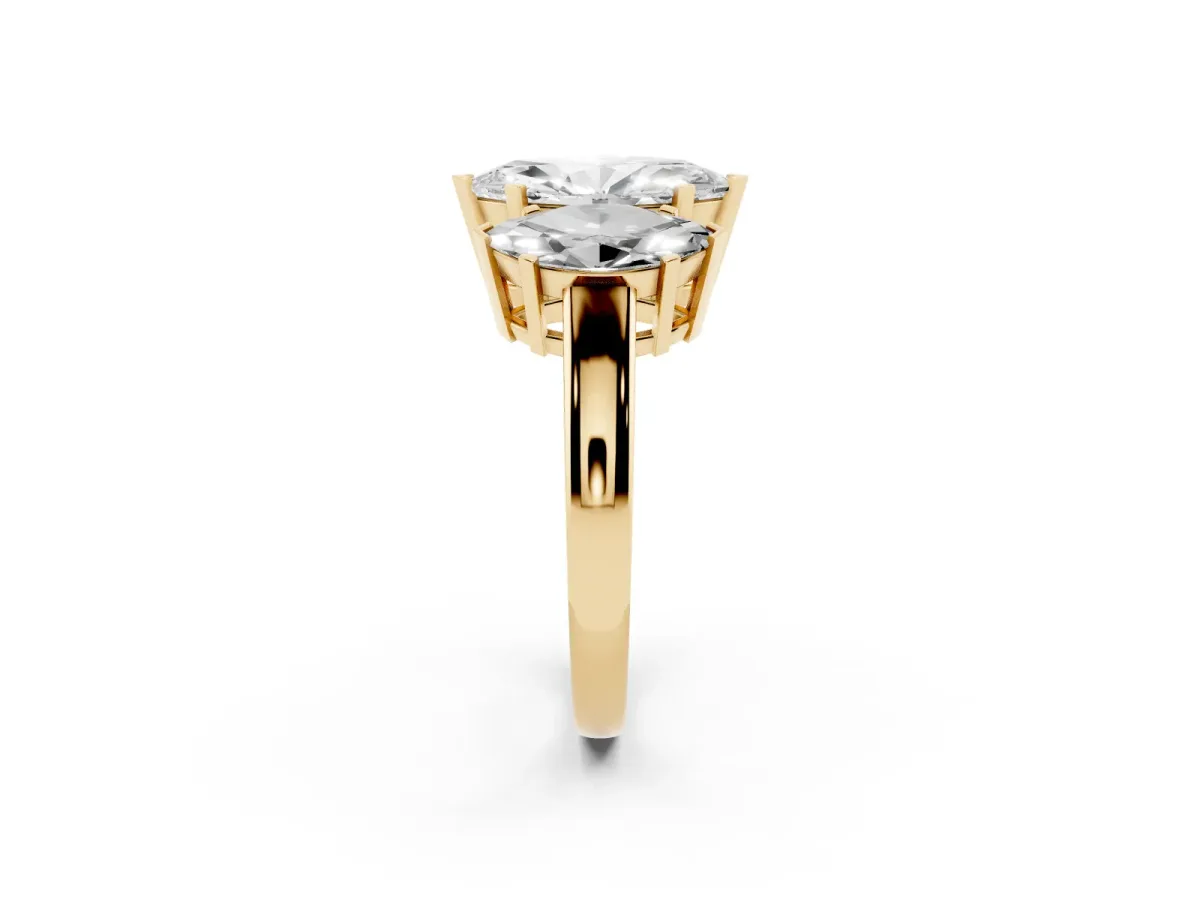 Three-Stone Marquise Cut Cut Diamond Ring with Channel Set Band and Four-Prong Setting Yellow gold