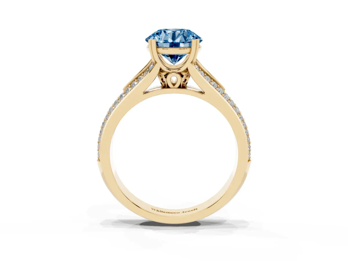 Fancy Blue Round Cut Diamond Split Shank Engagement Ring with Pavé Band Yellow gold