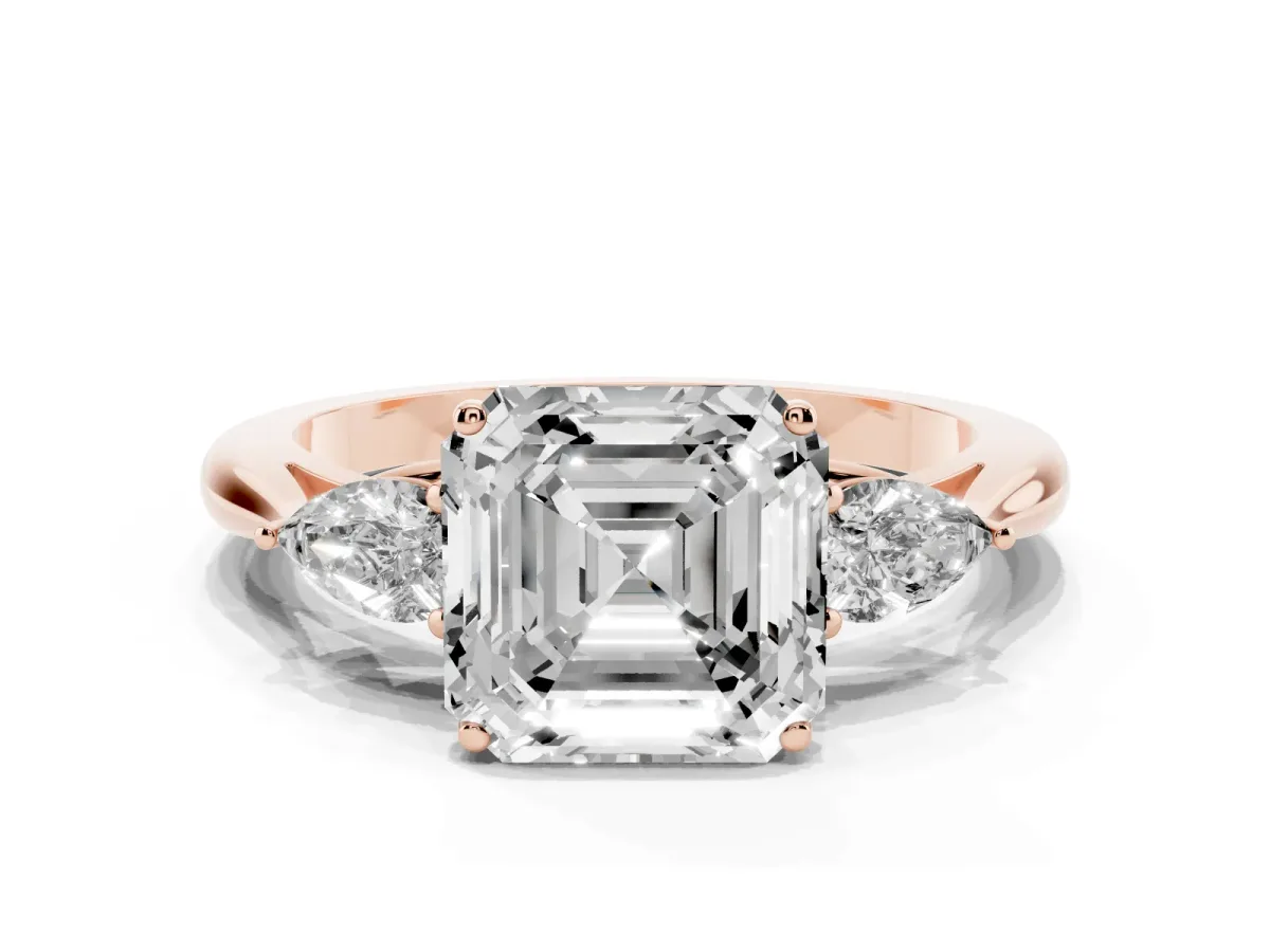 Three-Stone Asscher Cut Diamond Ring with Pear Side Stones in Four-Prong Setting Rose gold