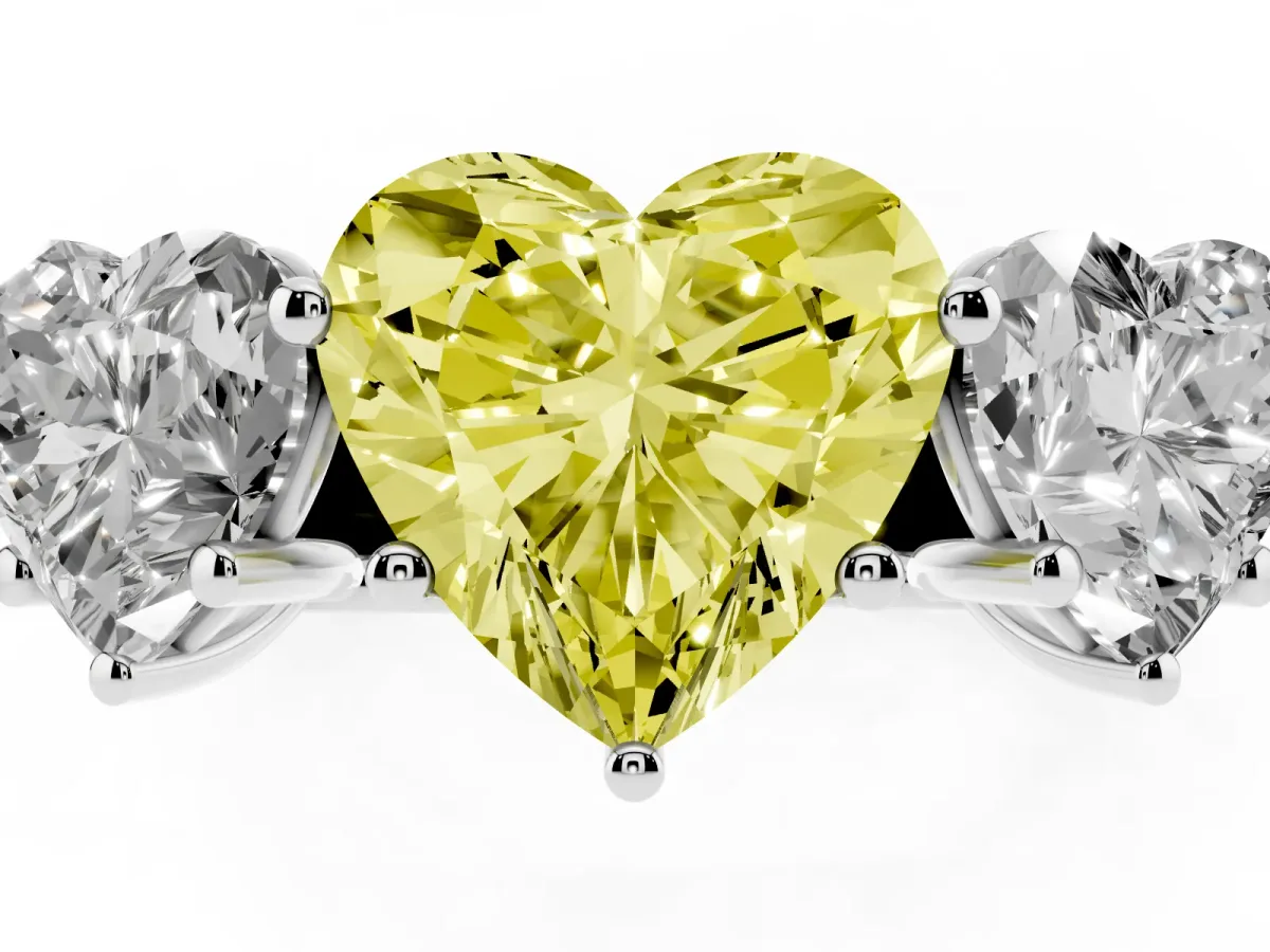 Fancy Yellow Heart Cut Three-Stone Diamond Ring with Prong Setting on a Classic Band Silver