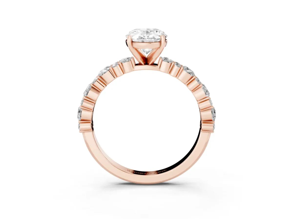 Oval Cut Diamond Side Stone Solitaire Ring with Round and Four-Prong Setting Rose gold