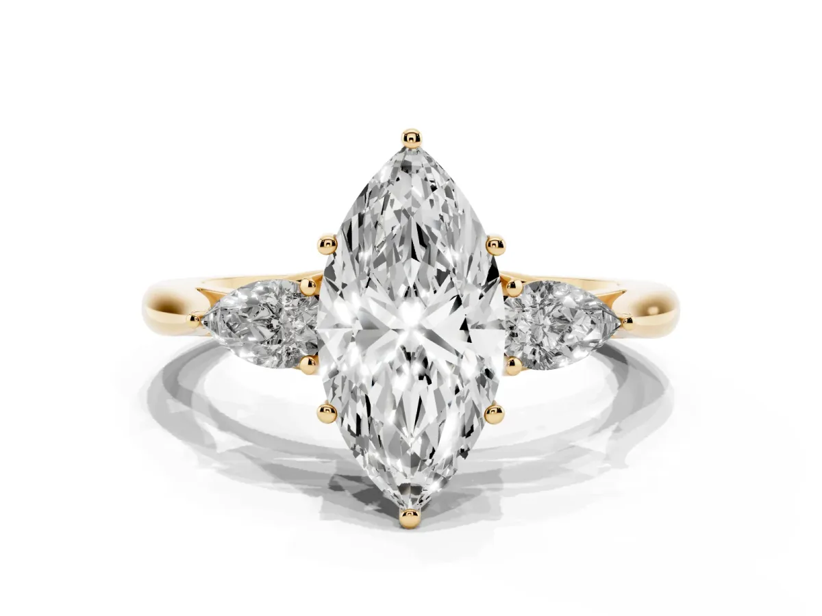 Marquise Cut Diamond Three-Stone Ring with Pear Side Stones and Prong Setting Yellow gold