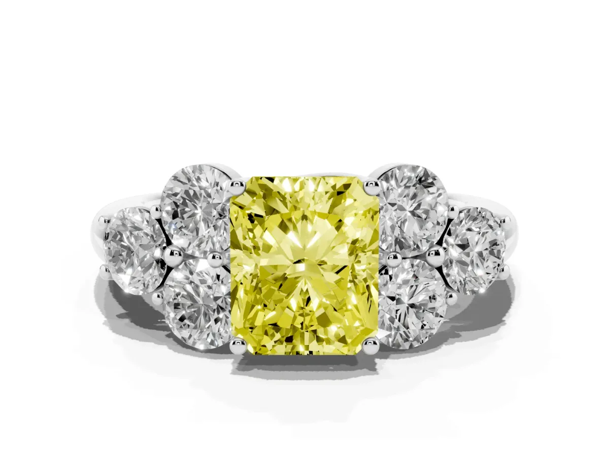 Fancy Yellow Radiant Cut Cut Diamond Cluster Ring with Round Accent Stones and Prong Setting on a Classic Band Platinum
