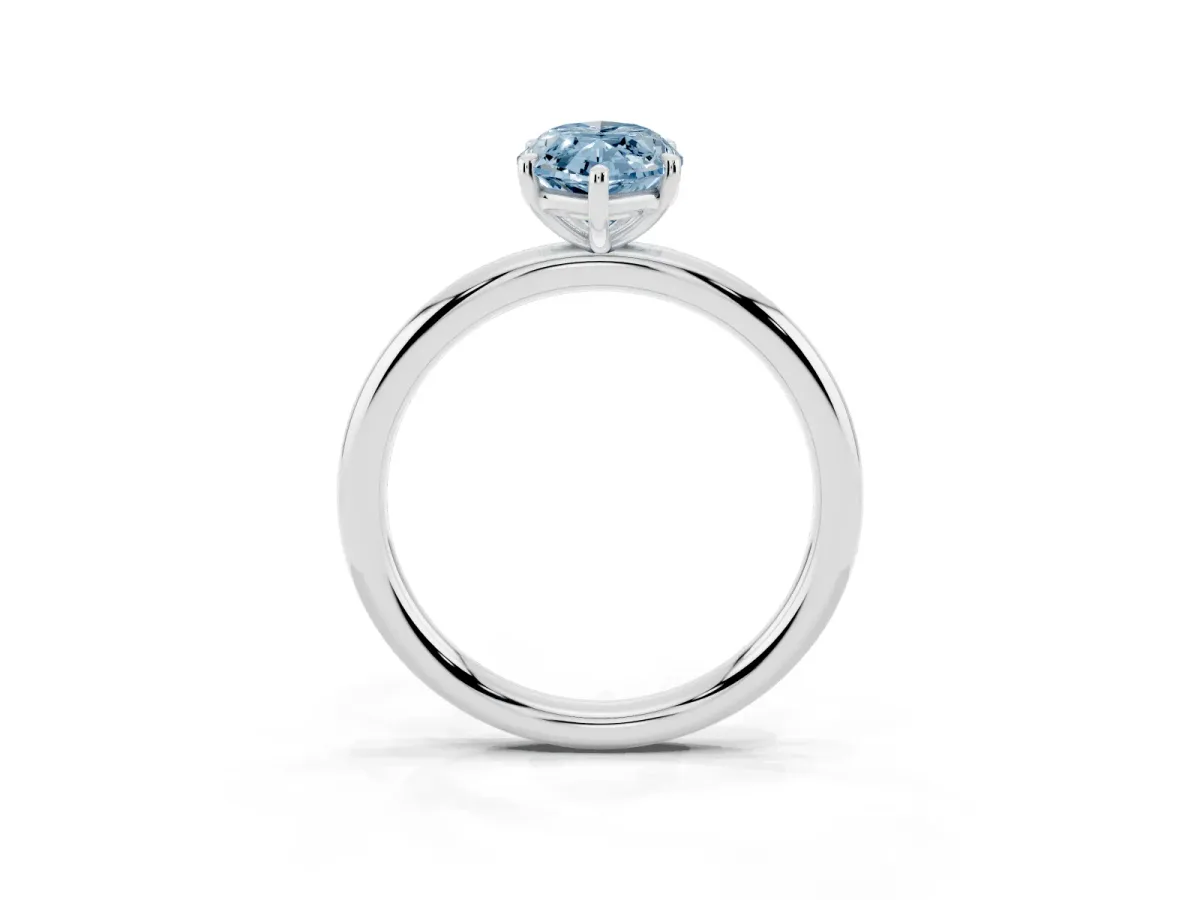 Fancy Blue Marquise Cut Solitaire Diamond Ring with Four-Prong Setting on a Plain Band Silver
