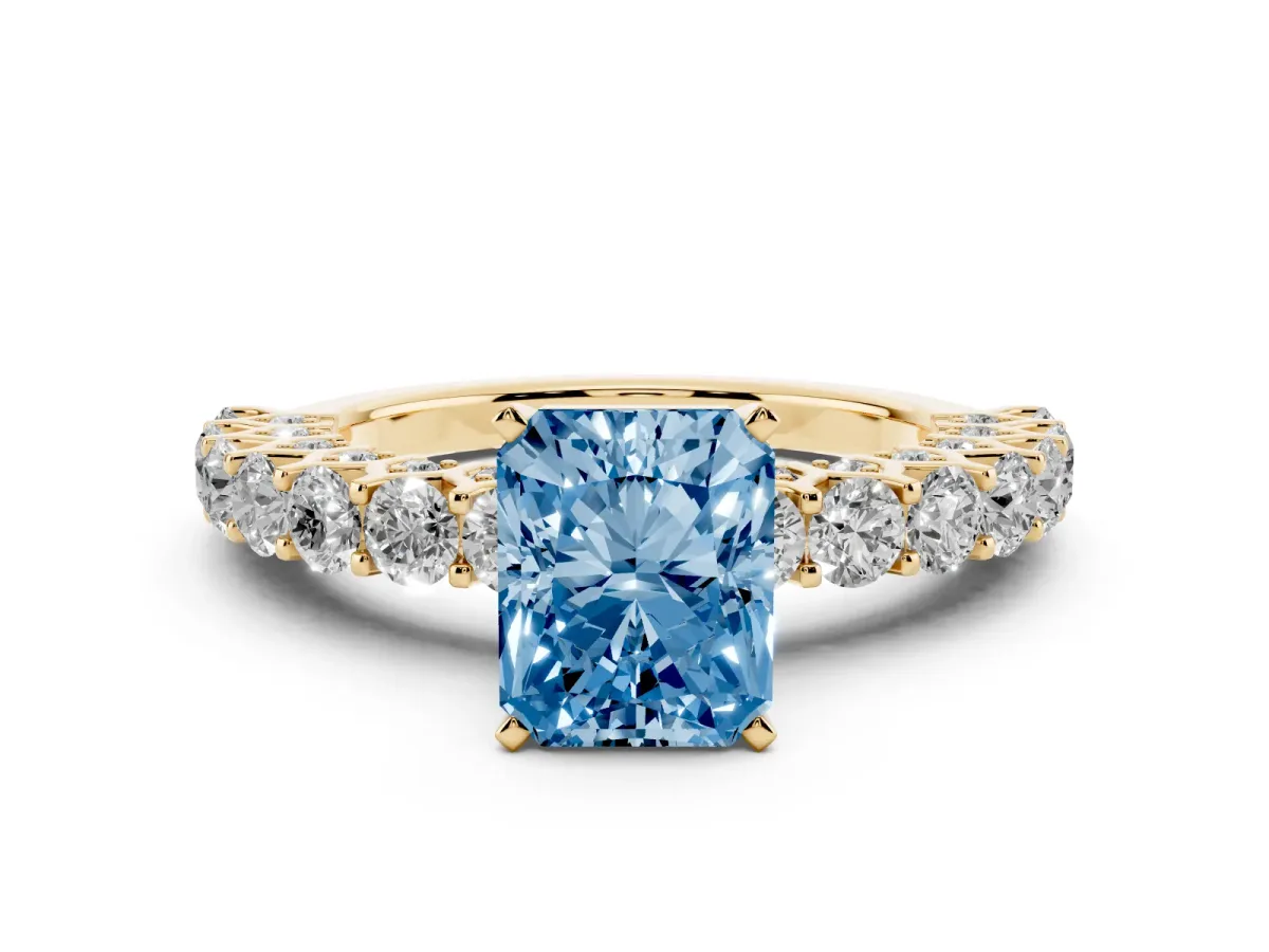 Fancy Blue Radiant Cut Diamond Solitaire Ring with Shared Prong Pavé Band and Four-Prong Setting Yellow gold