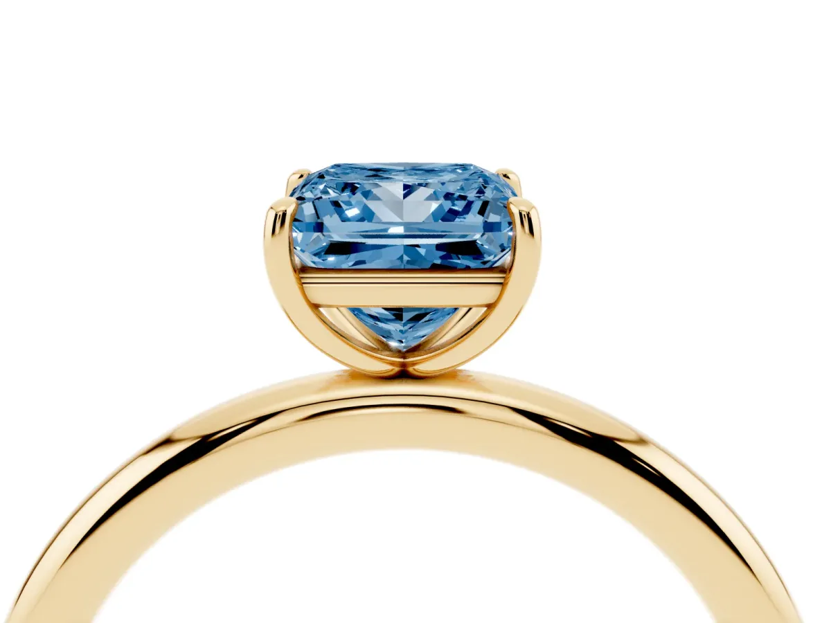 Fancy Blue Princess Cut Solitaire Diamond Ring with Four-Prong Setting on a Plain Band Yellow gold