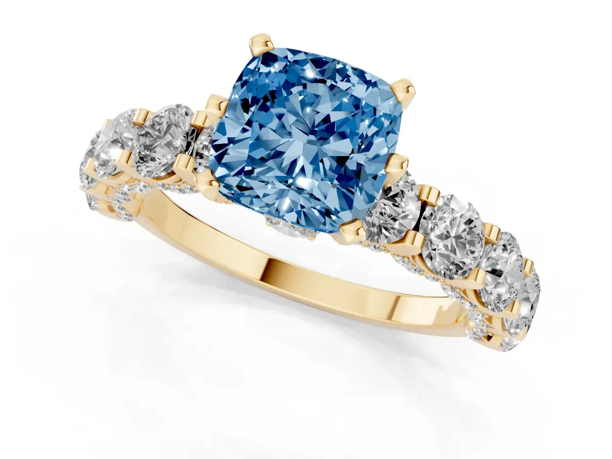Fancy Blue Cushion Cut Diamond Side Stone Engagement Ring with Four-Prong Setting Yellow gold
