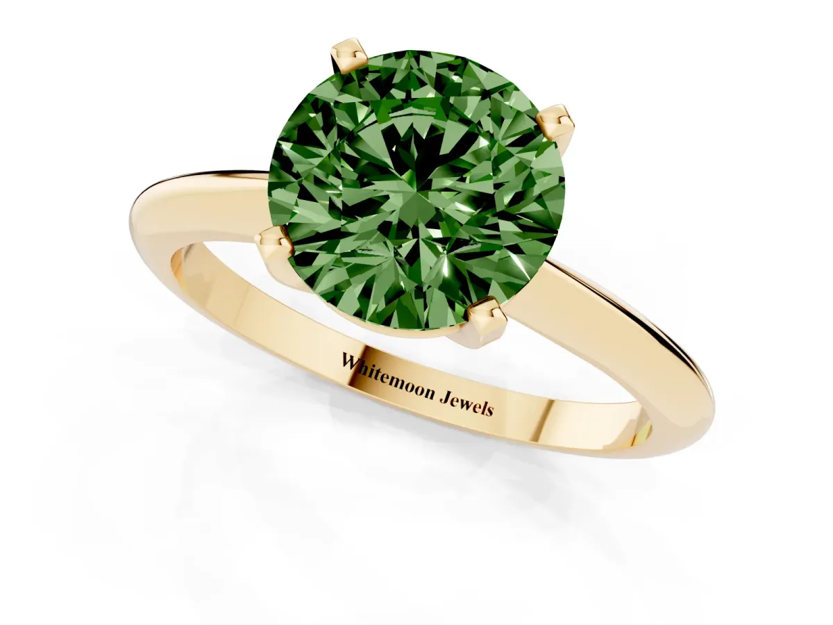 Fancy Green Round Cut Cut Solitaire Ring with Four-Prong Setting on a Classic Band Yellow gold