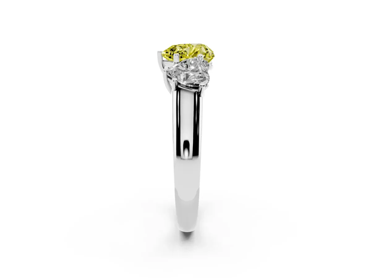 Fancy Yellow Heart Cut Three-Stone Diamond Ring with Prong Setting on a Classic Band Silver