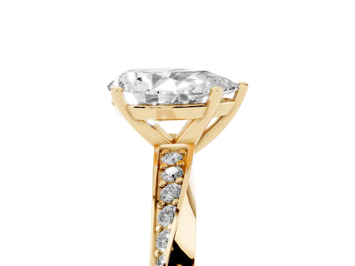 Pear Cut Diamond Engagement Ring with Side Stone Accents and Four-Prong Setting Yellow gold