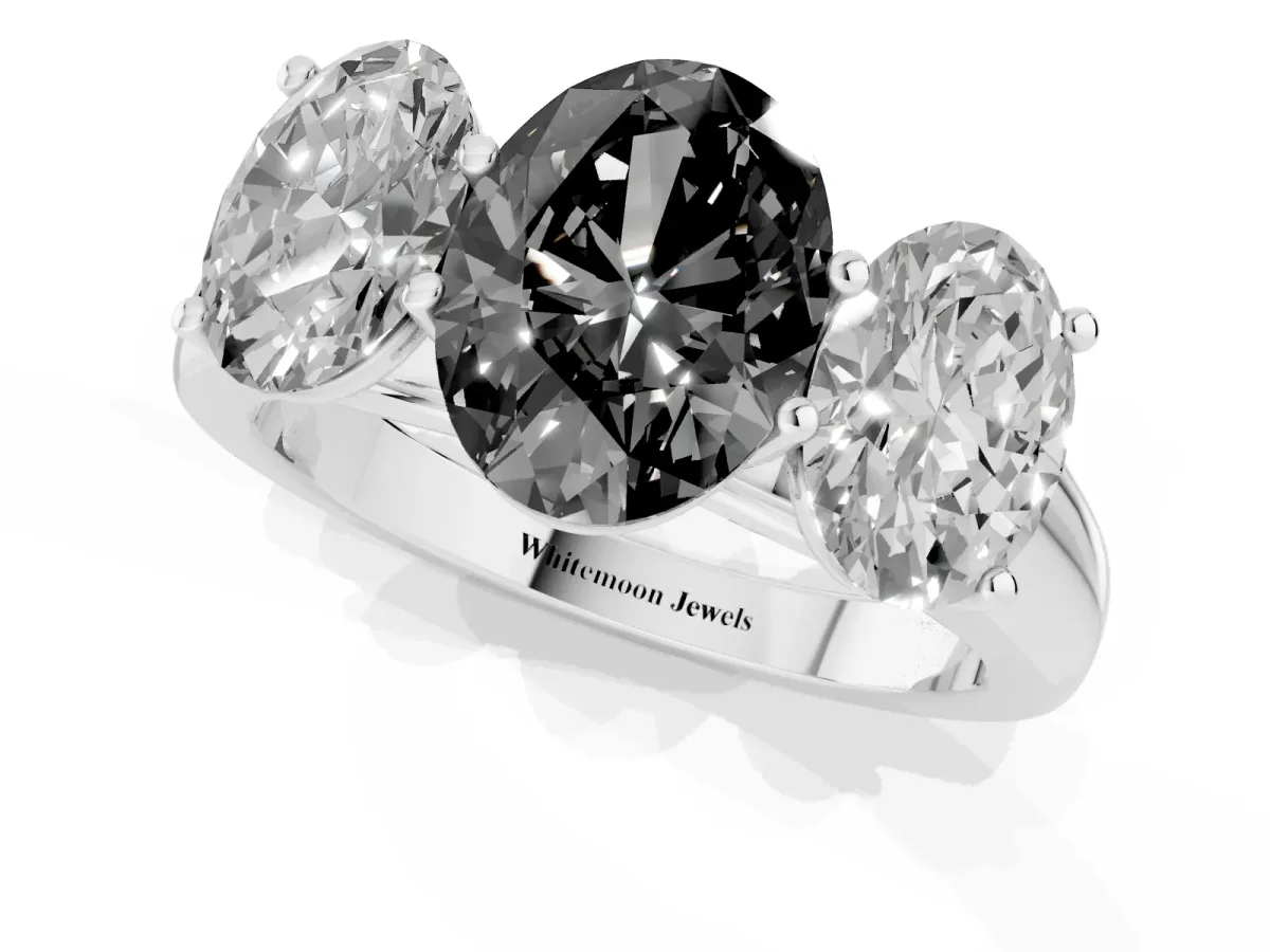 Fancy Black Oval Cut Three-Stone Diamond Ring with Prong Setting on a Classic Band Platinum