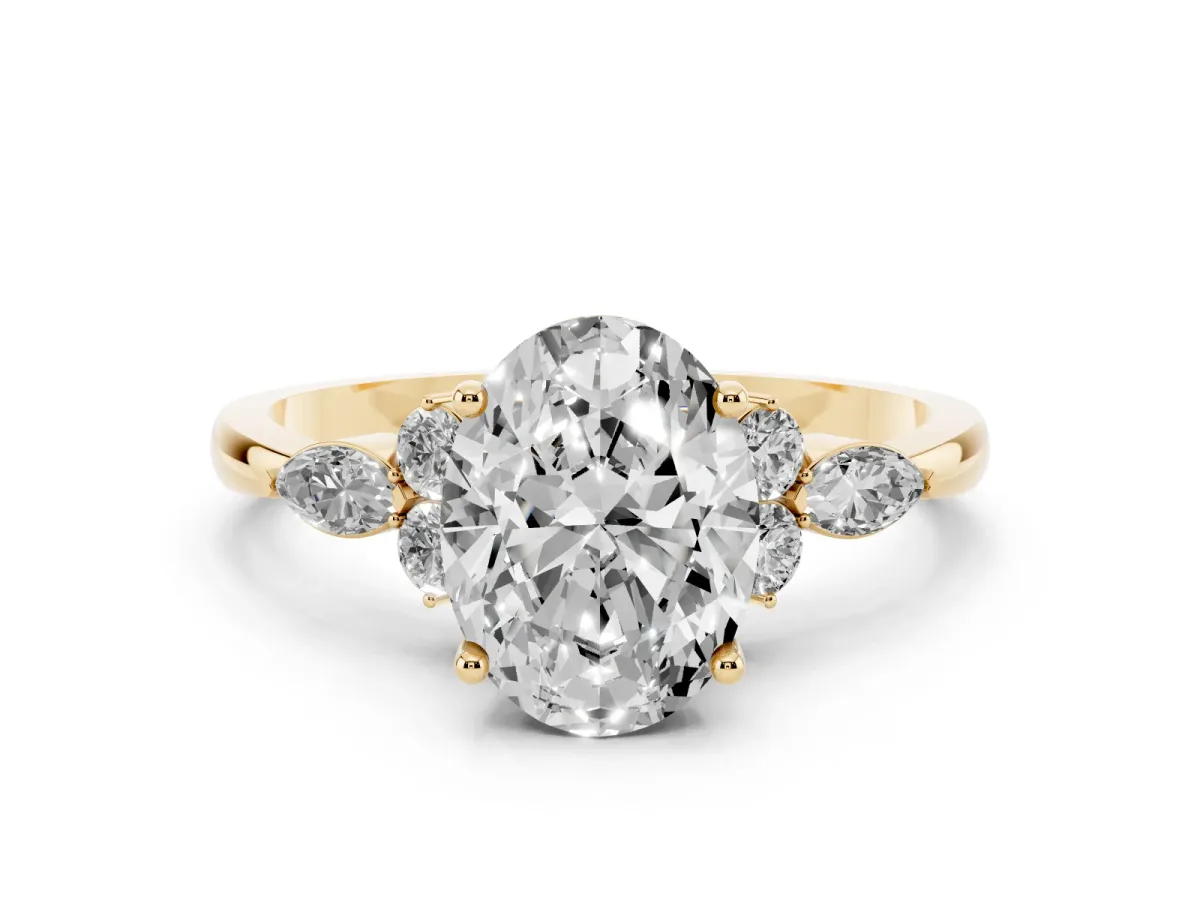 Oval Cut Brilliant Diamond Solitaire Ring with Pear Side Stones and Four-Prong Setting Yellow gold