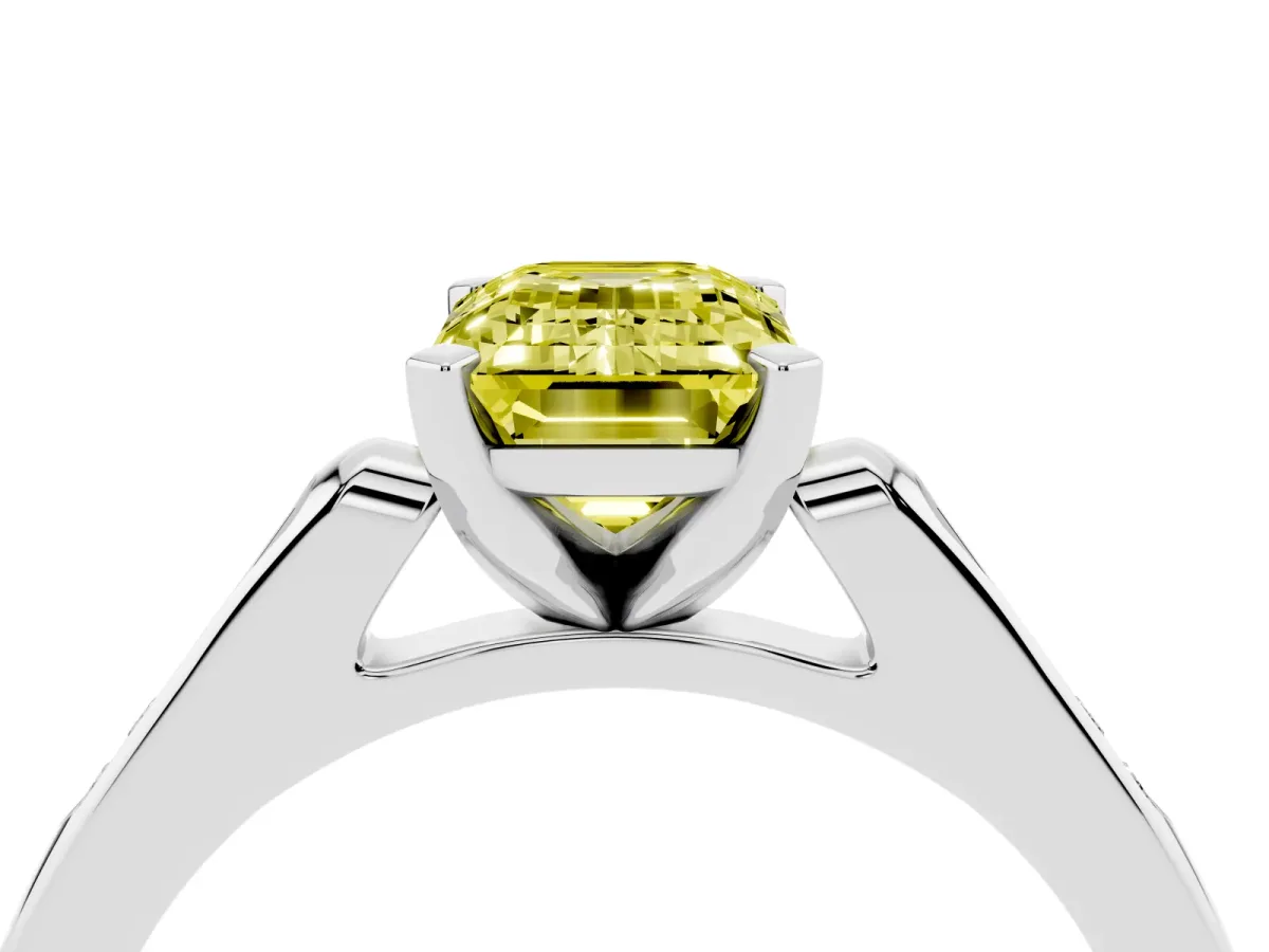 Fancy Yellow Emerald Cut Diamond Solitaire Ring with Channel Set Round Band and Prong Setting Silver