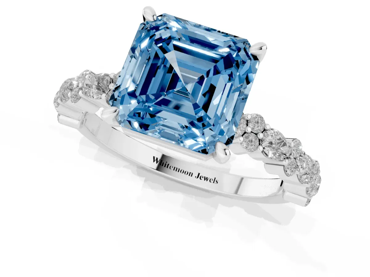 Fancy Blue Asscher Cut Diamond Side Stone Solitaire Ring with Round and Four-Prong Setting Platinum
