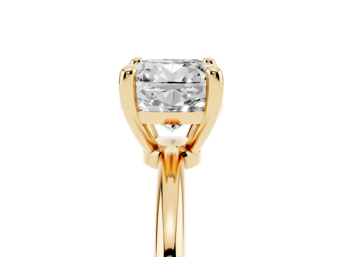 Cushion Cut Solitaire Diamond Ring with 4-Prong Setting on a Classic Band Yellow gold