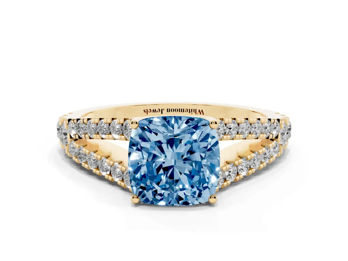 Fancy Blue Cushion Cut Diamond Split Shank Engagement Ring with Round Pavé and Prong Setting Yellow gold