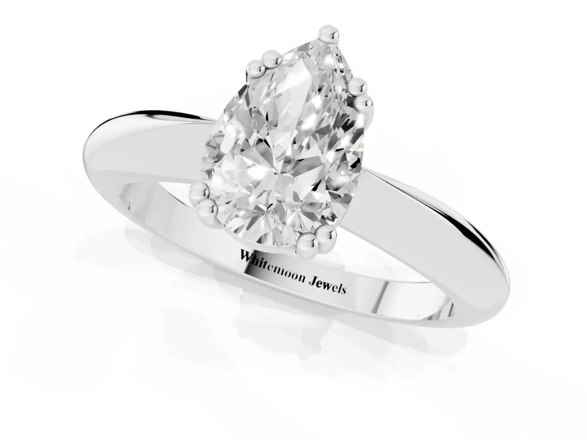 Pear Cut Cut Solitaire Engagement Ring with Tapered Band and Four-Prong Setting Platinum
