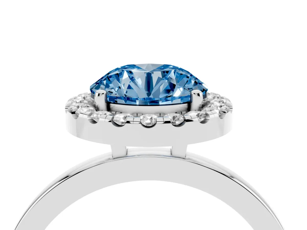 Fancy Blue Round Cut Halo Diamond Solitaire with Pavé Band and Four-Prong Setting Silver