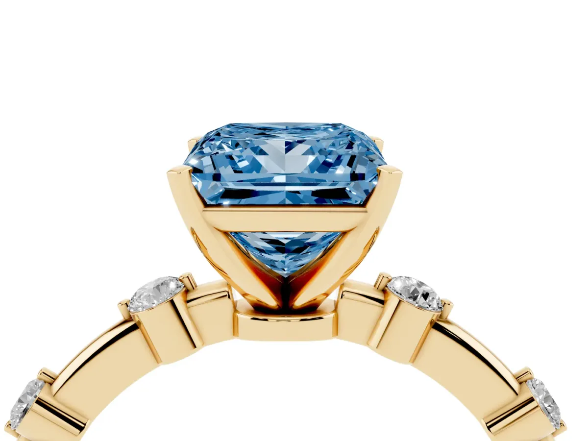 Fancy Blue Princess Cut Solitaire Diamond Ring with Bezel Set Side Stones and Prong Setting Yellow gold