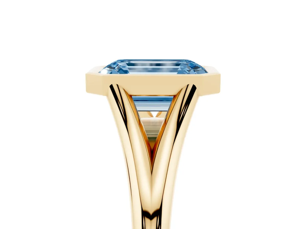 Fancy Blue Bezel Set Emerald Cut Cut Solitaire Ring with Tapered Band Yellow gold