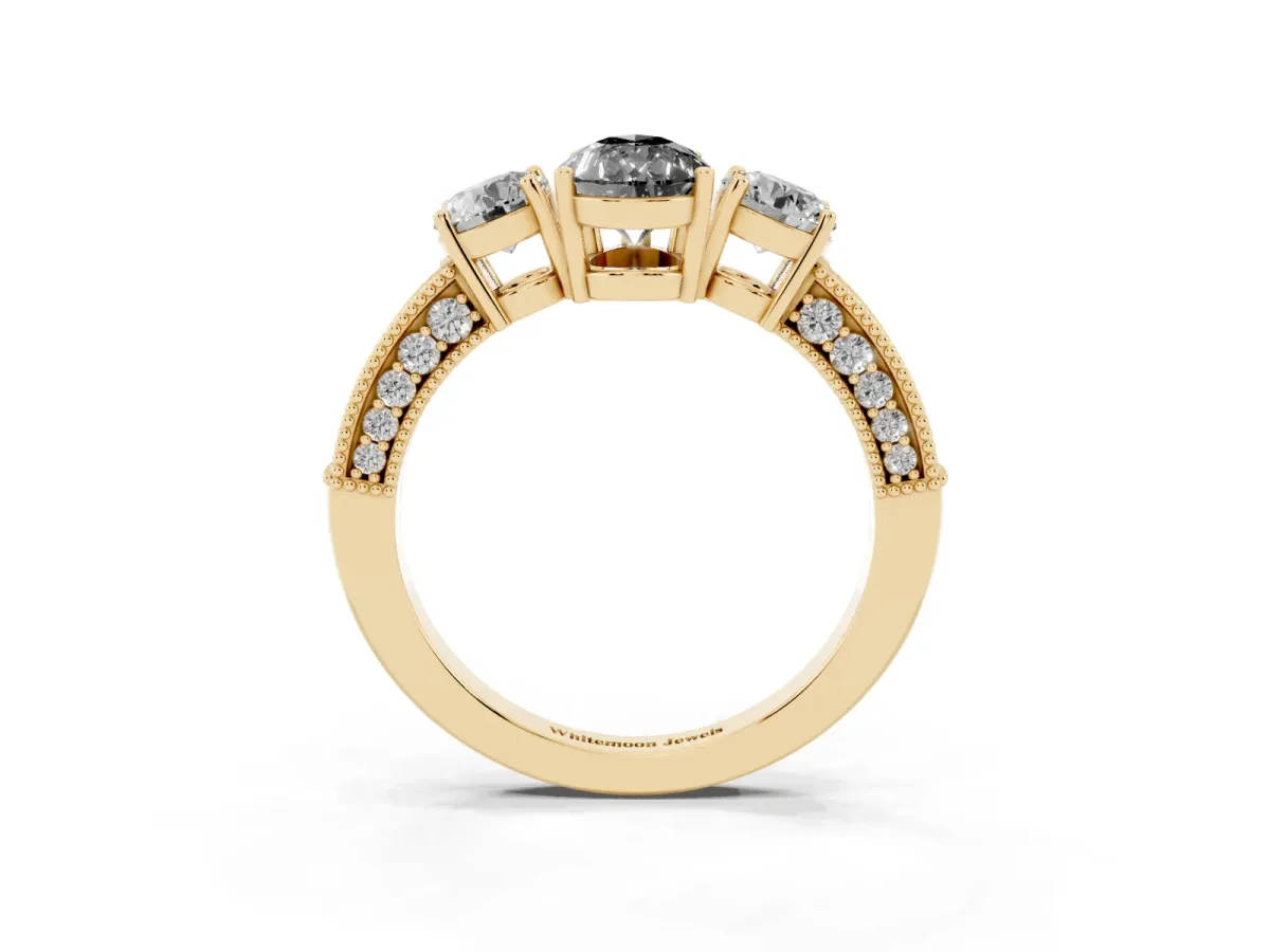 Fancy Black Pear Cut Three-Stone Diamond Ring with Pavé Band and Four-Prong Setting Yellow gold