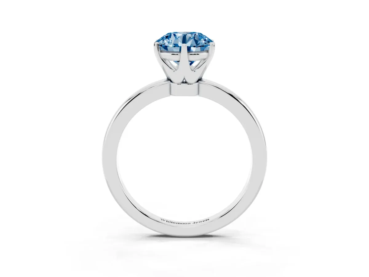 Fancy Blue Round Cut Solitaire Diamond Ring with Six-Prong Setting on a Classic Band Silver