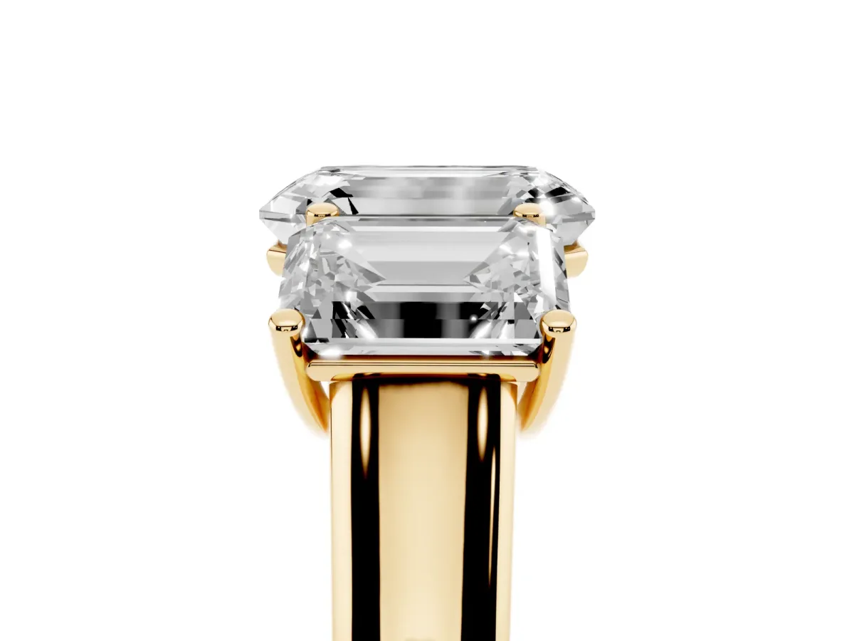 Emerald Cut Three-Stone Diamond Ring with Prong Setting on a Classic Band Yellow gold