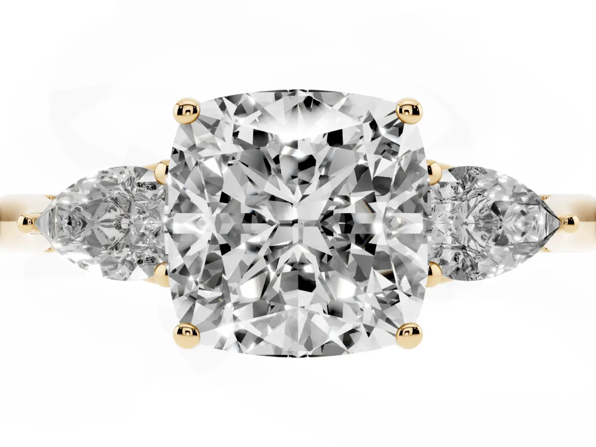 Cushion Cut Diamond Three-Stone Ring with Pear Side Stones and Prong Setting Yellow gold