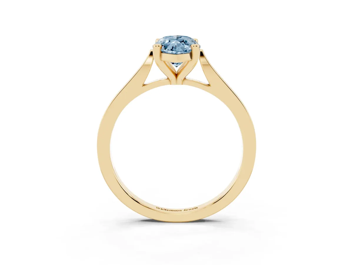 Fancy Blue Marquise Cut Solitaire Diamond Ring with Four-Prong Setting and Tapered Band Yellow gold