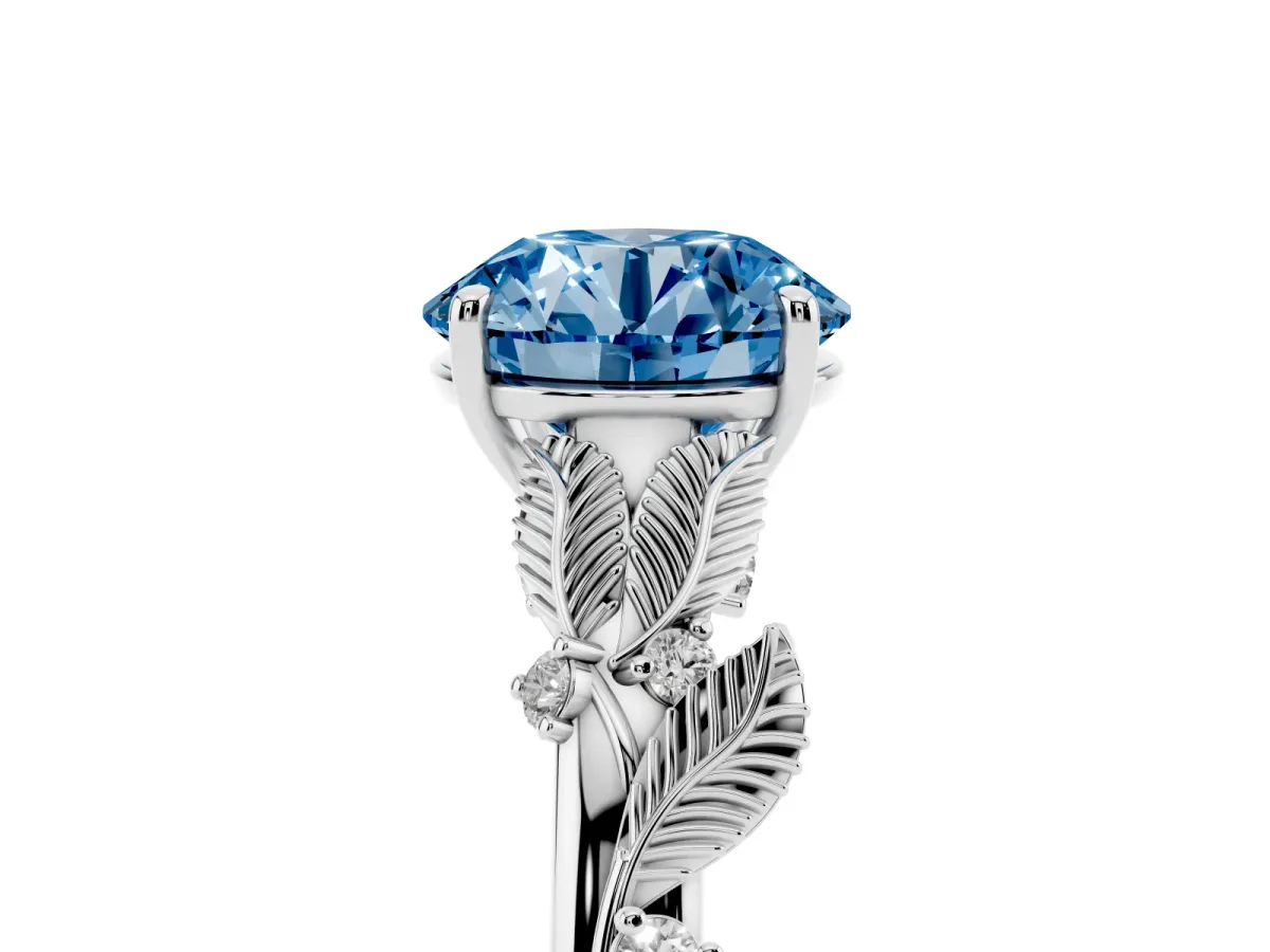 Fancy Blue Round Cut Diamond Solitaire Ring with Leaf Motif Band and Four-Prong Setting Silver