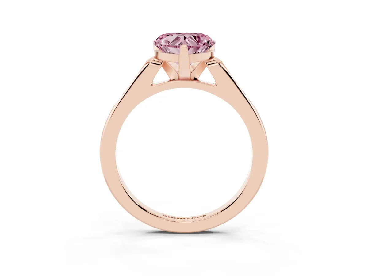 Fancy Pink Heart Cut Diamond Solitaire Ring with Channel Set Round Band and Prong Setting Rose gold