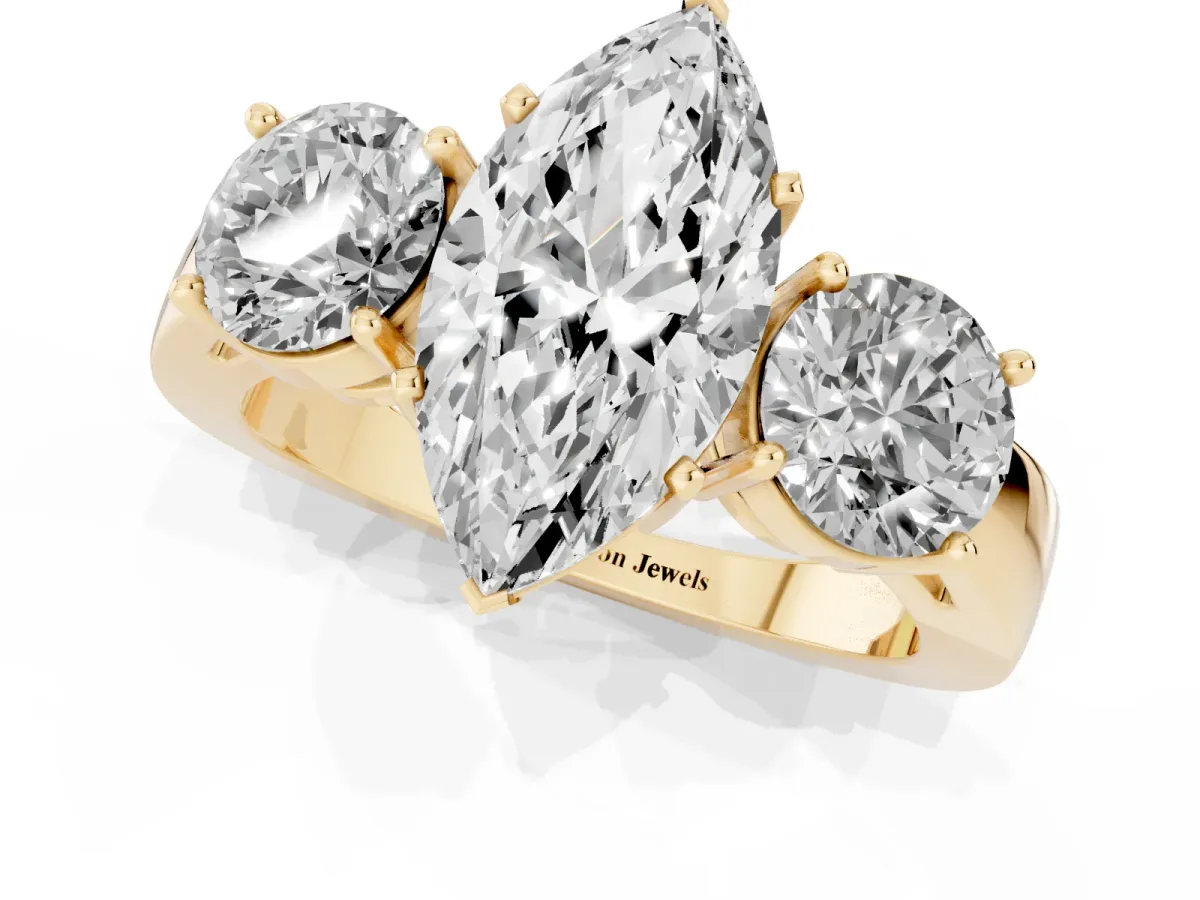 Three-Stone Marquise Cut Diamond Ring with Round Side Stones, Classic Band, and Four-Prong Setting Yellow gold