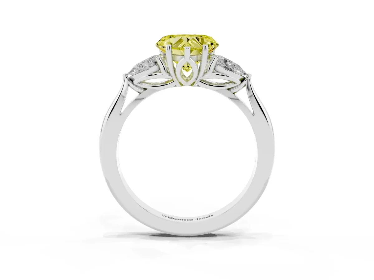 Fancy Yellow Three-Stone Heart Cut Brilliant Diamond Solitaire Ring with Tapered Band and Four-Prong Setting Silver
