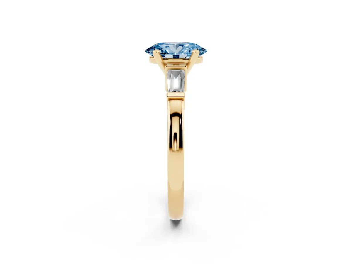 Fancy Blue Oval Cut Cut Diamond Solitaire Ring with Tapered Baguette Accents and Four-Prong Setting Yellow gold