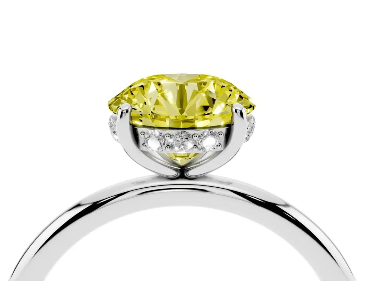 Fancy Yellow Round Cut Solitaire Diamond Ring with a Classic Band and Four-Prong Setting Silver