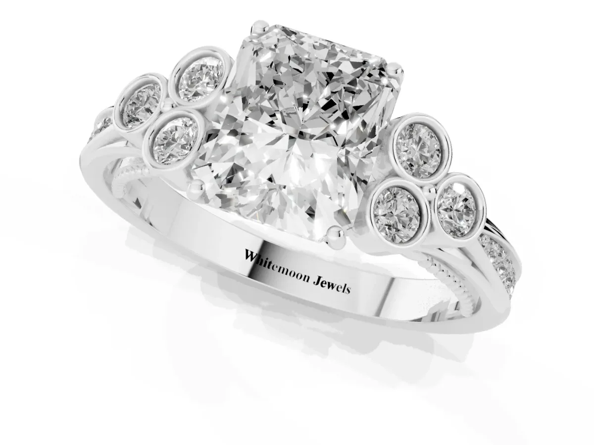 Radiant Cut Cut Diamond Engagement Ring with Bezel Set Round Side Stones and Prong Setting Silver