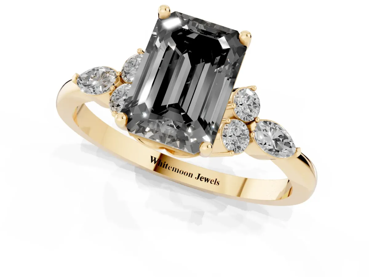 Fancy Black Emerald Cut Brilliant Diamond Solitaire Ring with Pear Side Stones and Four-Prong Setting Yellow gold