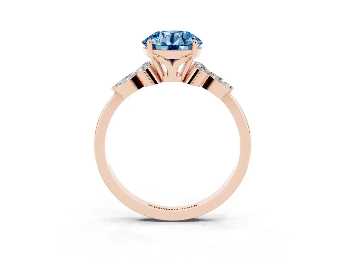 Fancy Blue Round Cut Brilliant Diamond Solitaire Ring with Pear Side Stones and Four-Prong Setting Rose gold