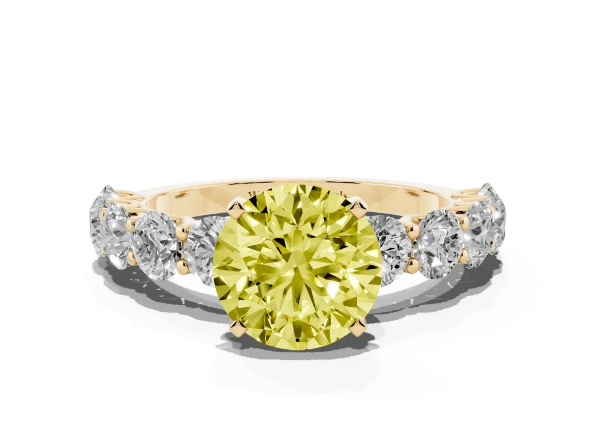 Fancy Yellow Round Cut Diamond Prong Setting with Side Stones on a Pave Band Yellow gold