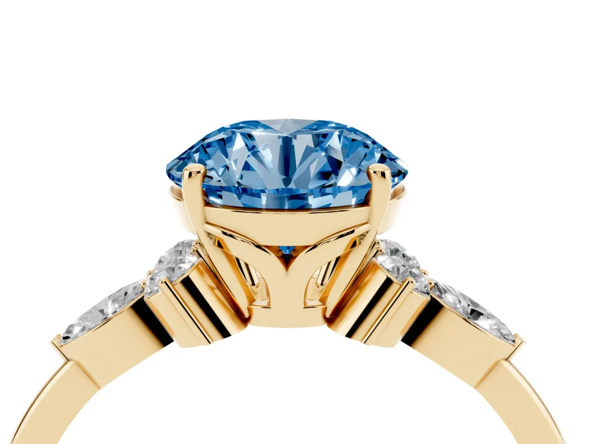 Fancy Blue Round Cut Brilliant Diamond Solitaire Ring with Pear Side Stones and Four-Prong Setting Yellow gold