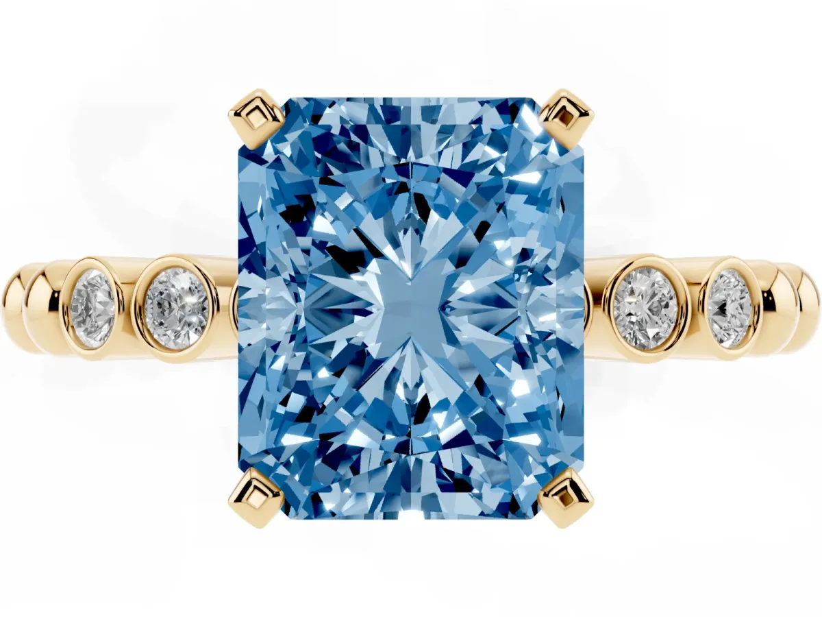 Fancy Blue Radiant Cut Solitaire Bezel Accent Diamond Engagement Ring with Beaded Band and Four-Prong Setting Yellow gold