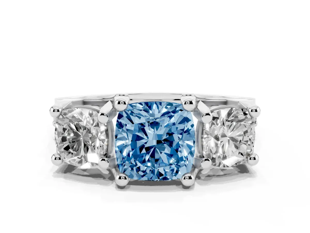 Fancy Blue Cushion Cut Diamond Three-Stone Ring with Channel Set Band and Four-Prong Setting Silver