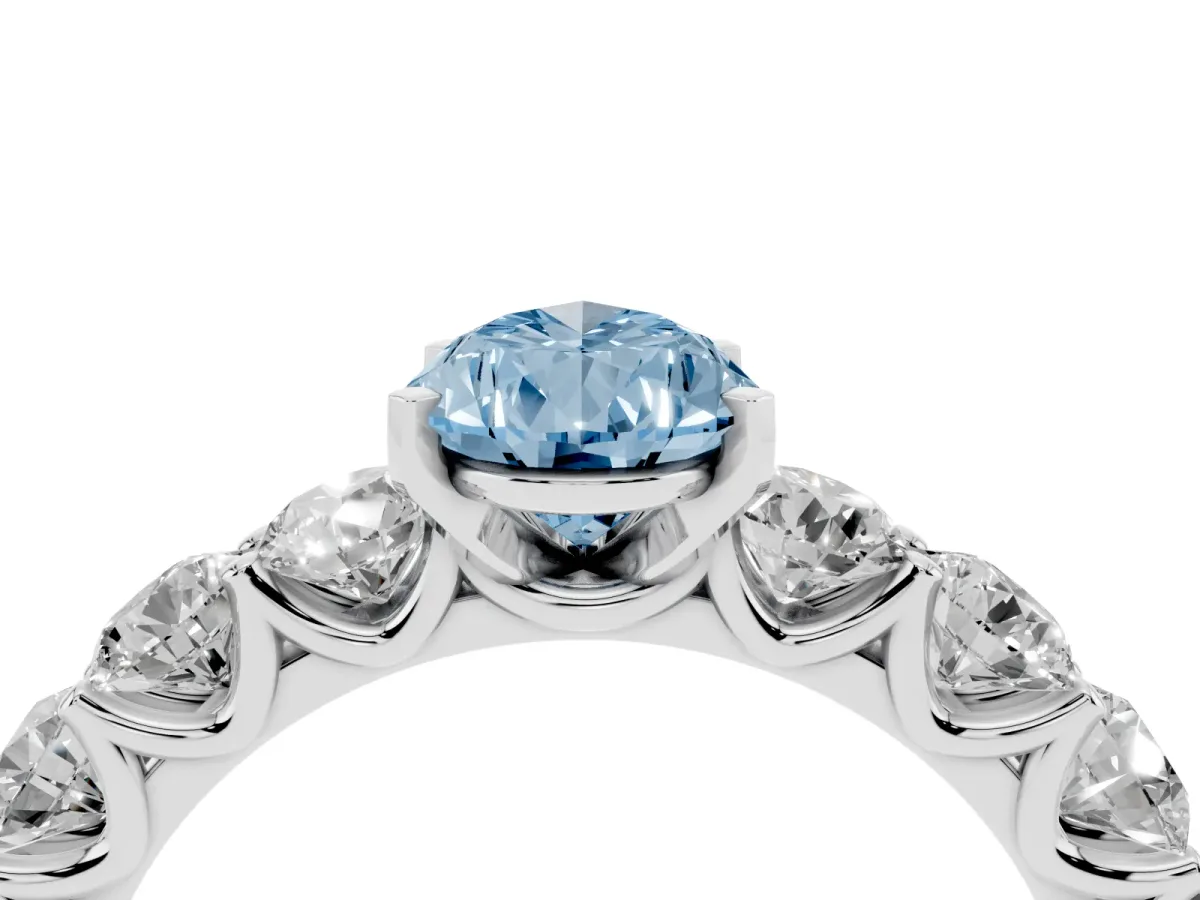 Fancy Blue Pear Cut Diamond Prong Setting with Side Stones on a Pave Band Platinum