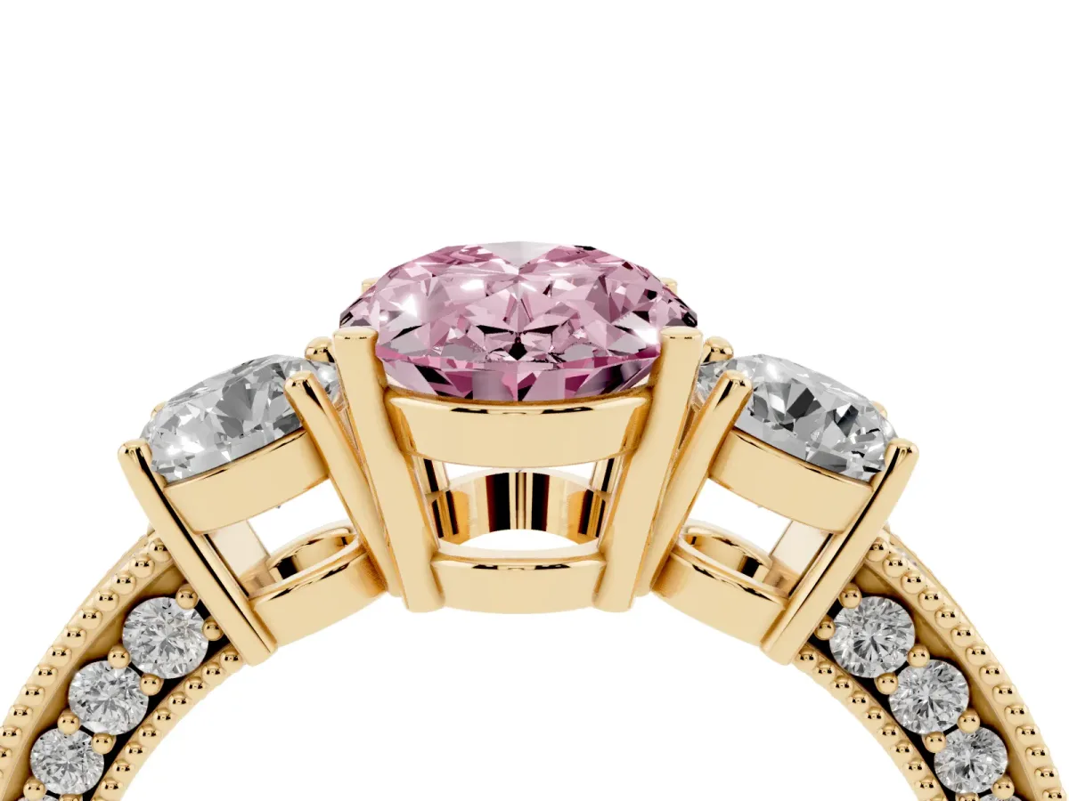 Fancy Pink Oval Cut Three-Stone Diamond Ring with Pavé Band and Four-Prong Setting Yellow gold
