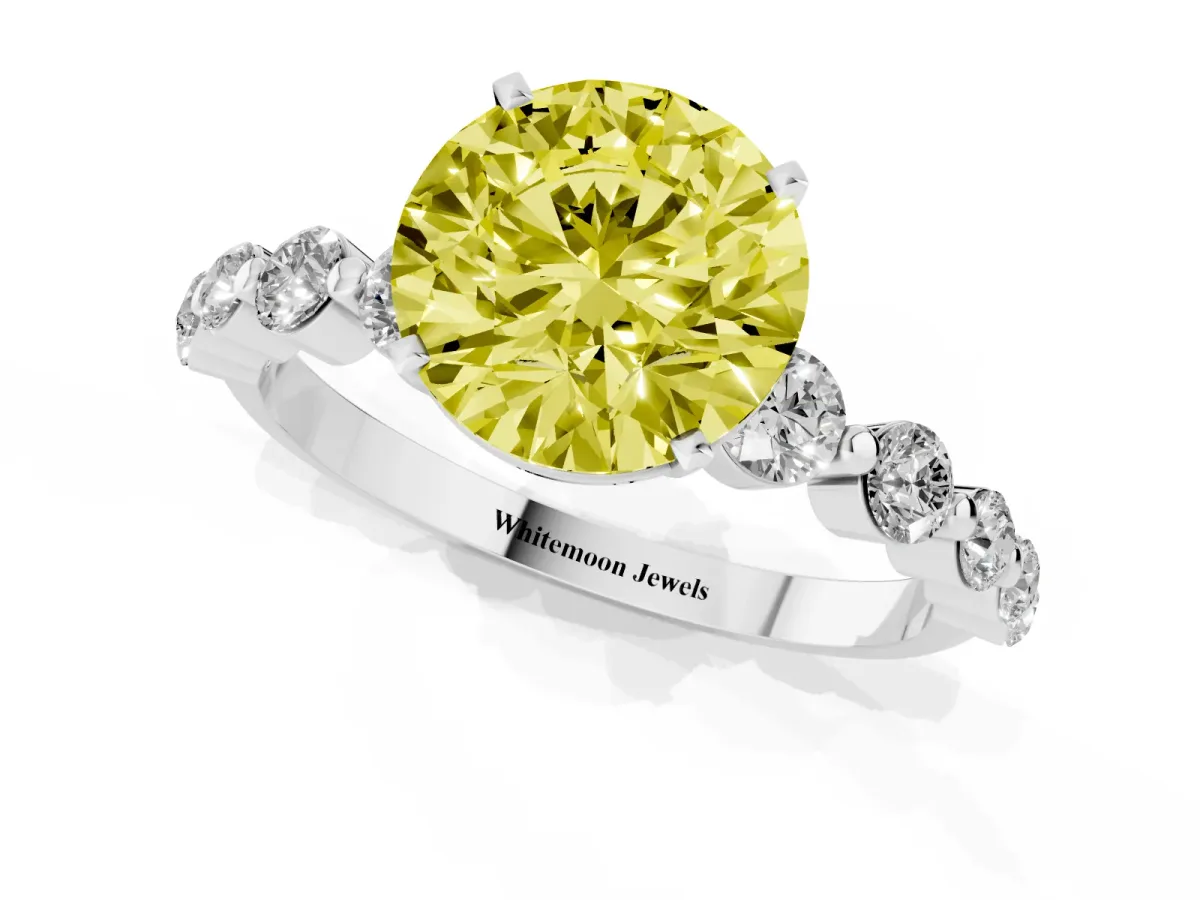 Fancy Yellow Round Cut Solitaire Diamond Ring with Pave Band and Four-Prong Setting Silver